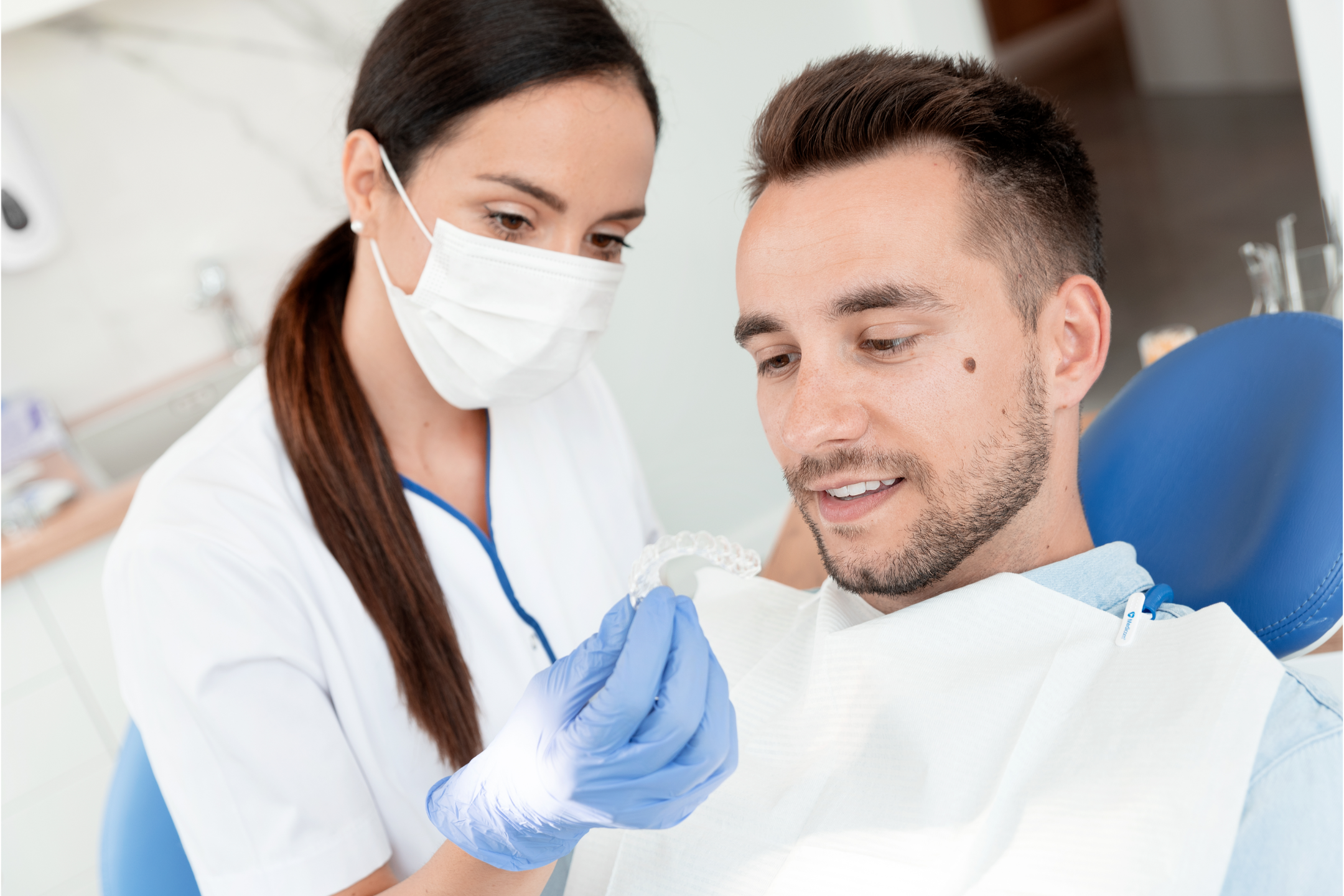 Dentist showing an Invisalign for a patient